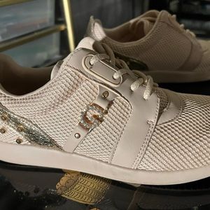 Guess light pink shoe lace up sneakers with golden G and spikes in size 7.5